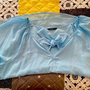 Light blue blouse, great for work or a night out in the town